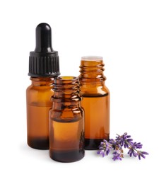 Photo of Essential oil and lavender flowers on white background