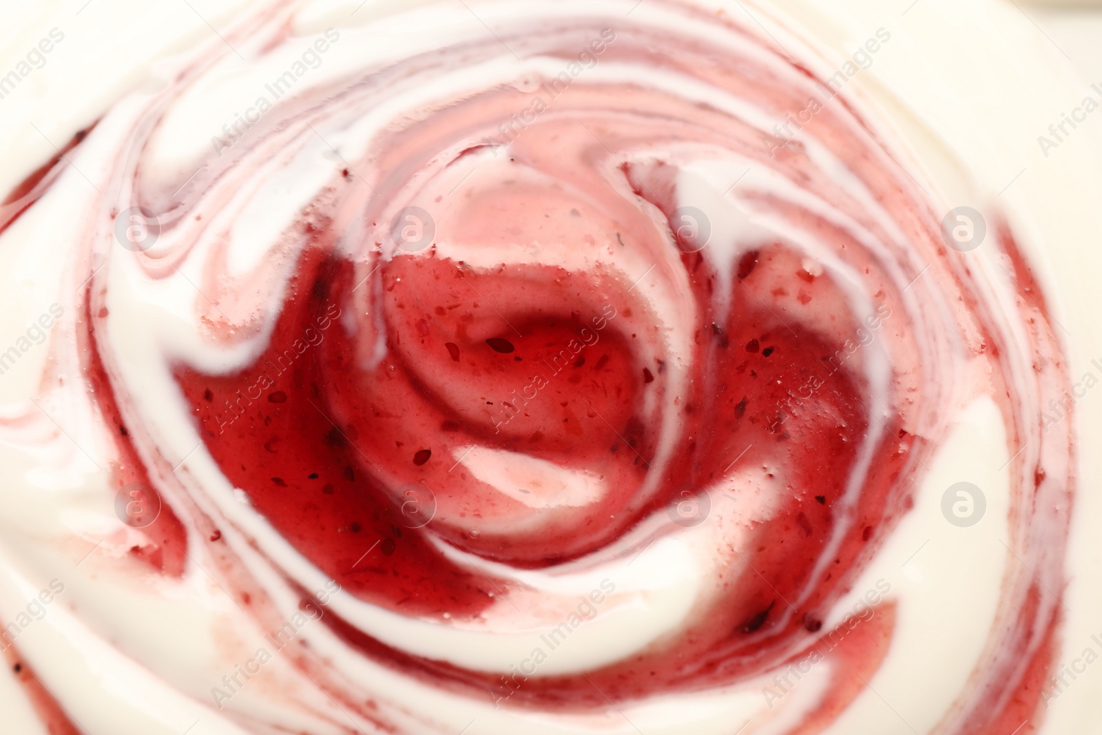 Photo of Tasty yoghurt with jam as background, closeup