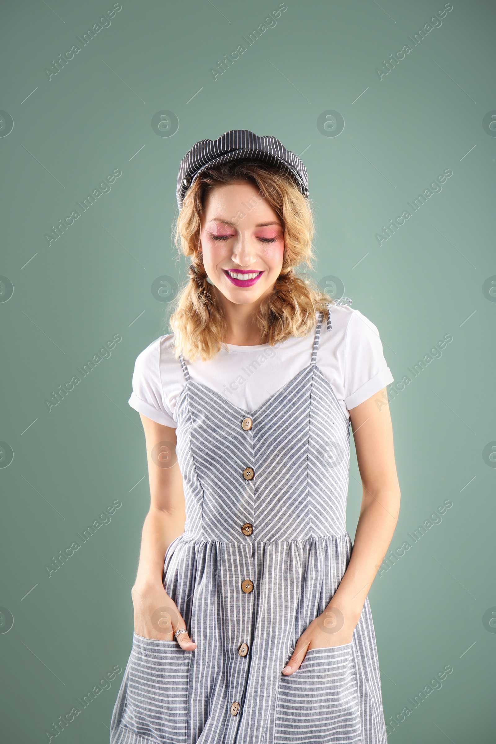 Photo of Beautiful young woman posing on color background. Summer fashion