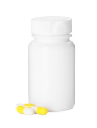 Photo of Antibiotic pills and bottle isolated on white