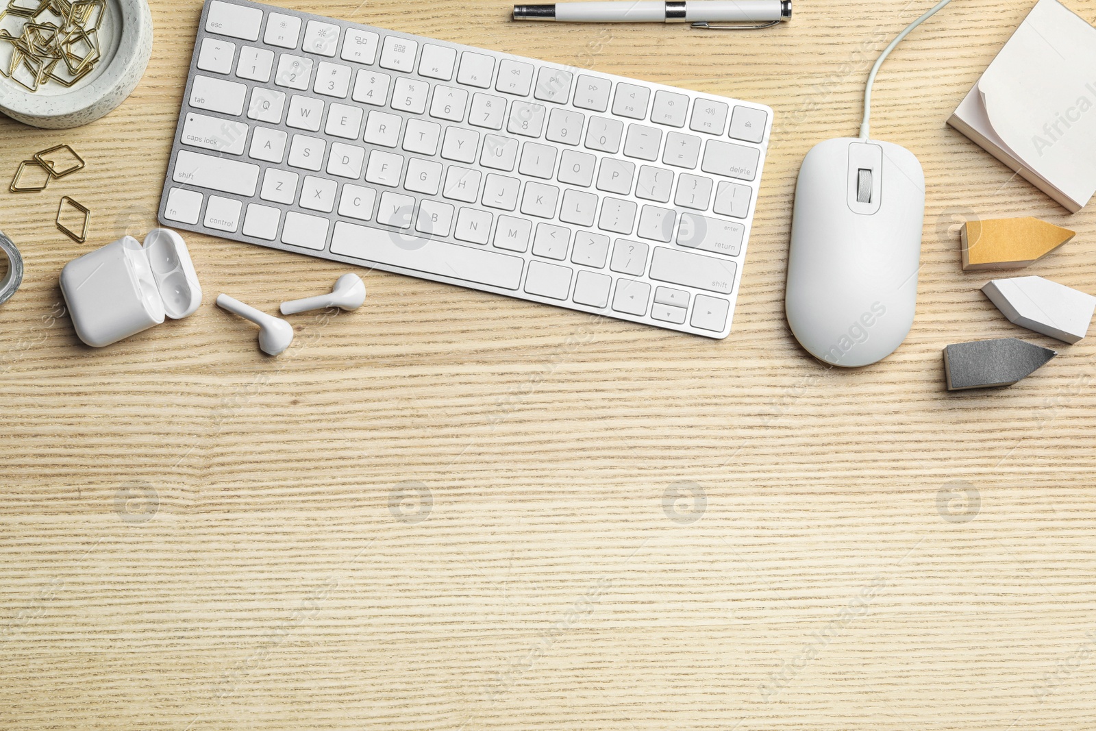 Photo of Flat lay composition with wired computer mouse and keyboard on  wooden table. Space for text