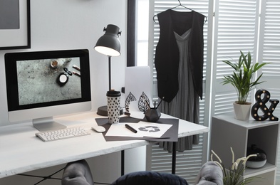 Photo of Stylish workplace with modern computer on desk