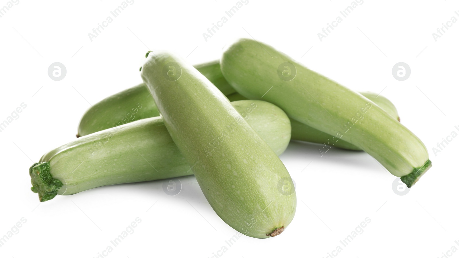 Photo of Fresh ripe green zucchinis isolated on white