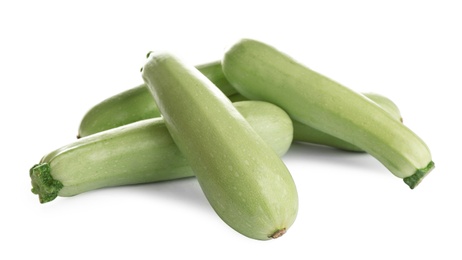 Fresh ripe green zucchinis isolated on white