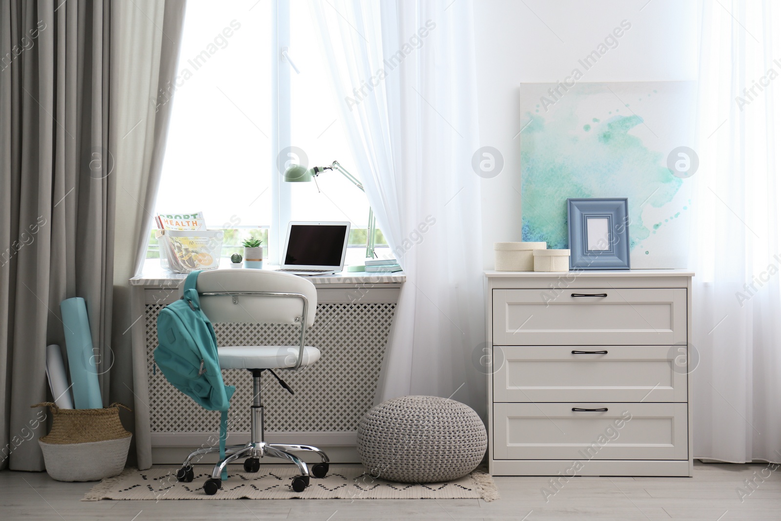 Photo of Comfortable workplace with laptop on window sill at home