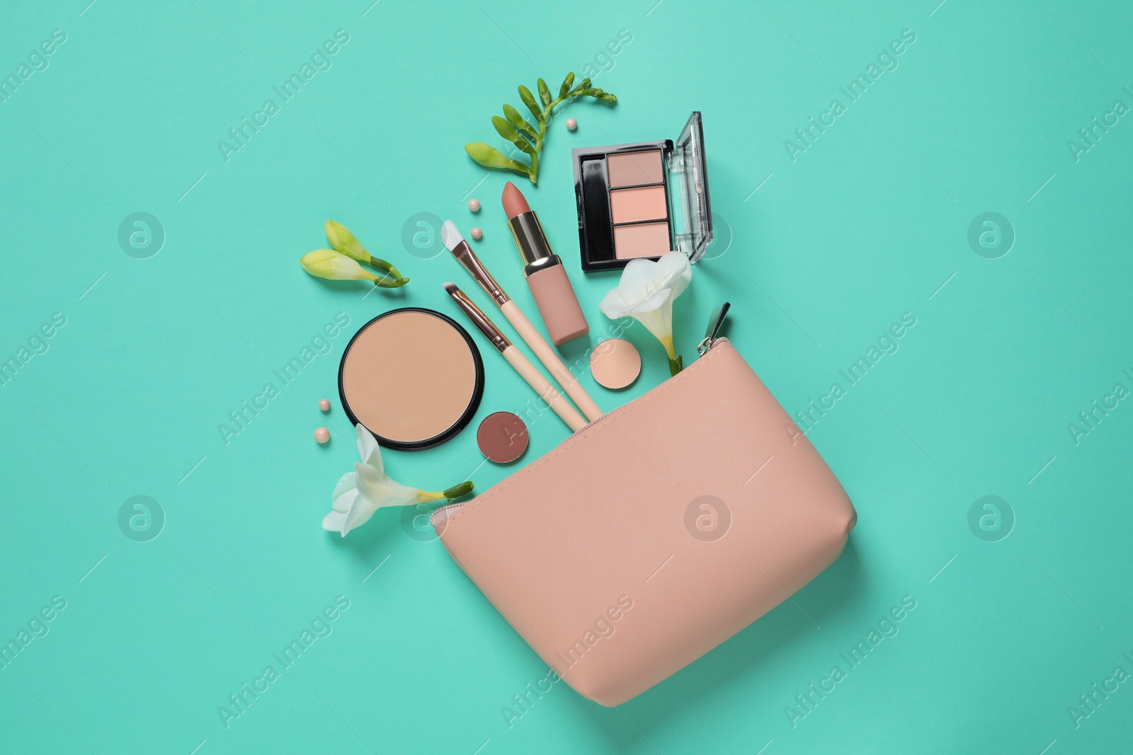 Photo of Flat lay composition with different makeup products and beautiful flowers on turquoise background