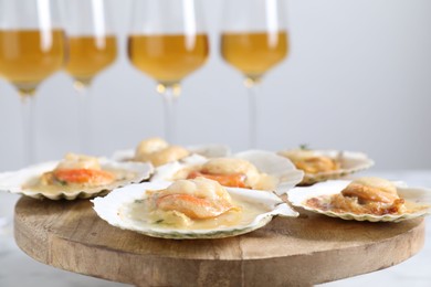 Photo of Fried scallops in shells on table, closeup