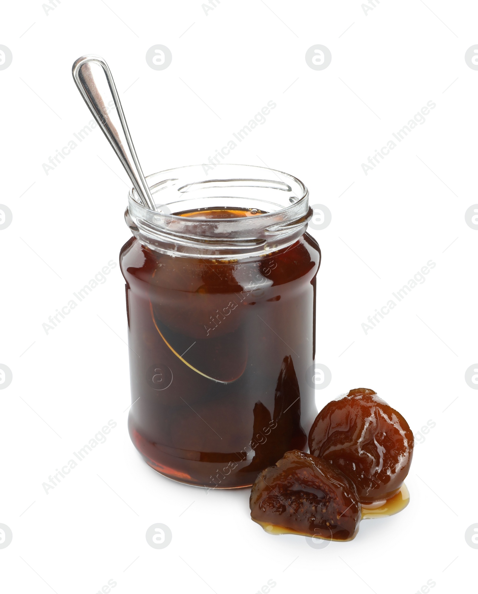 Photo of Jar of tasty sweet fig jam and spoon isolated on white