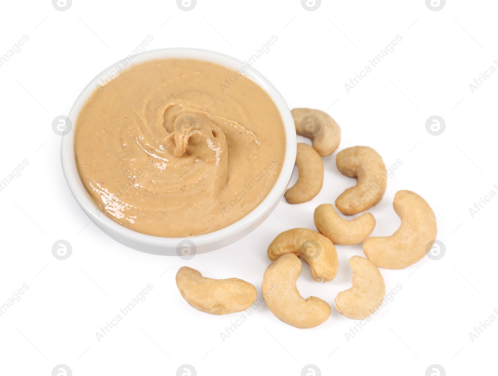 Photo of Delicious nut butter and cashews isolated on white