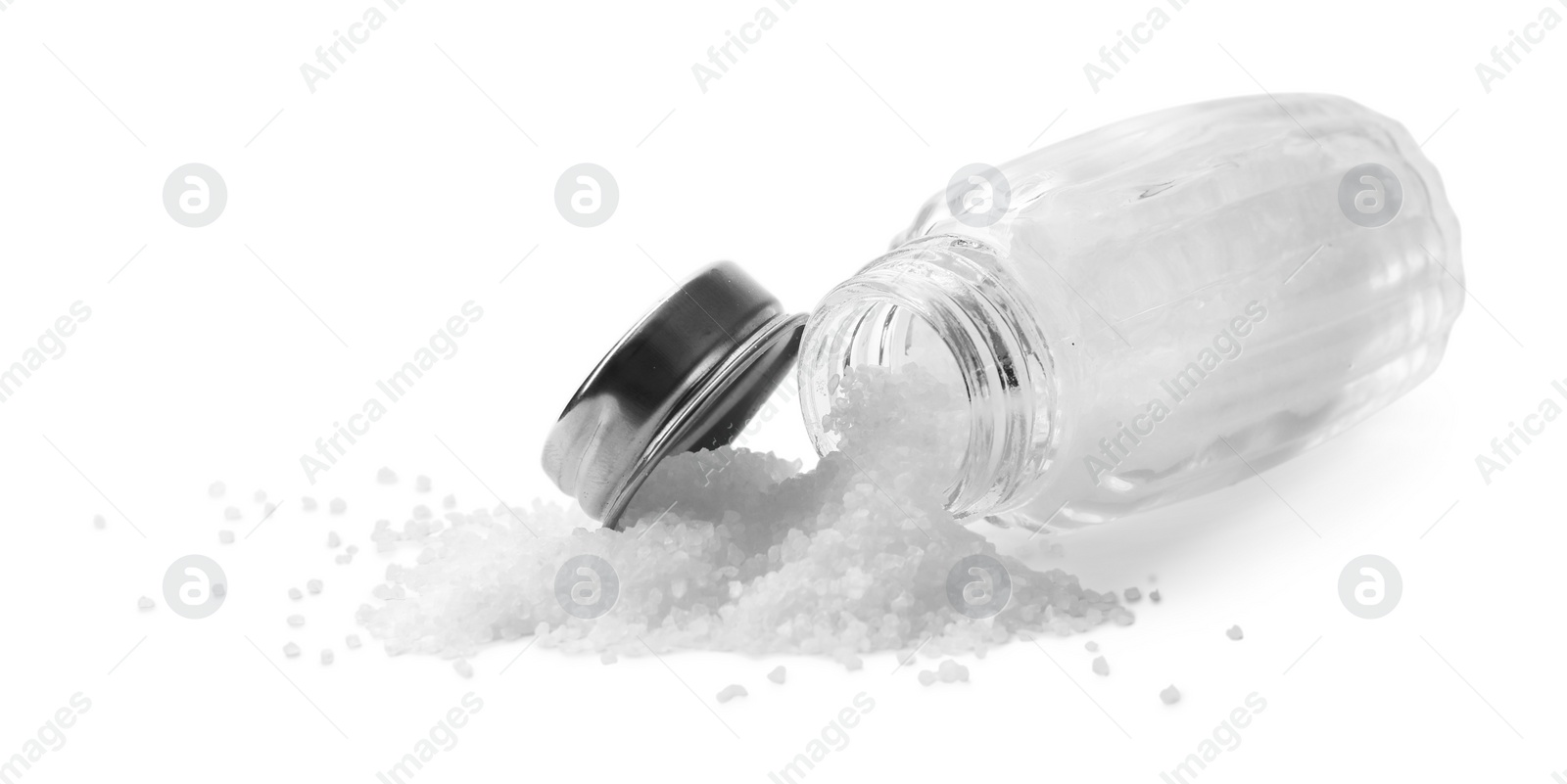 Photo of Natural salt in shaker isolated on white