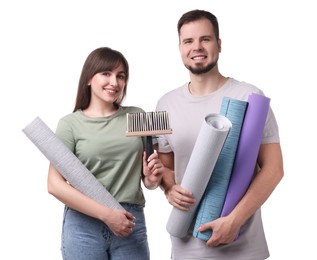 Couple with wallpaper rolls and brush on white background