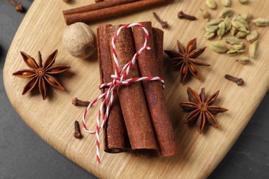 Different spices and nut on table, flat lay