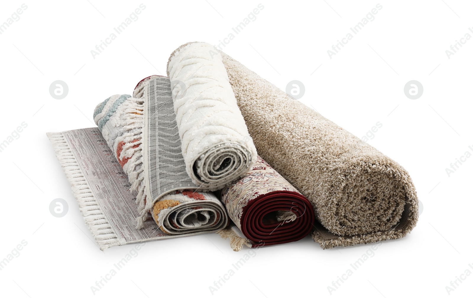 Photo of Rolled carpets on white background. Interior element