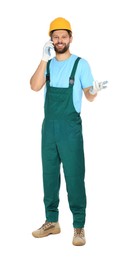 Photo of Professional repairman in uniform talking on smartphone against white background