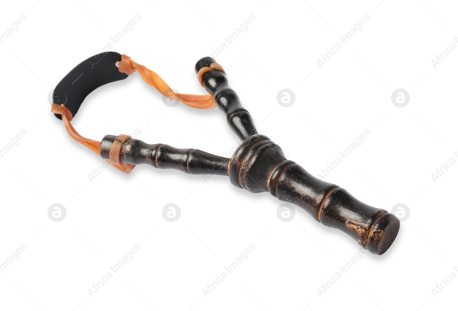 Photo of Black wooden slingshot with leather pouch on white background