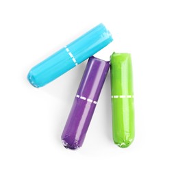 Photo of Colorful tampons on white background, top view. Menstrual hygiene product