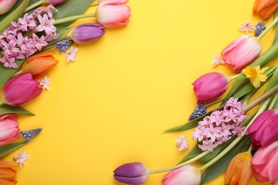 Photo of Beautiful different flowers on yellow background, flat lay. Space for text