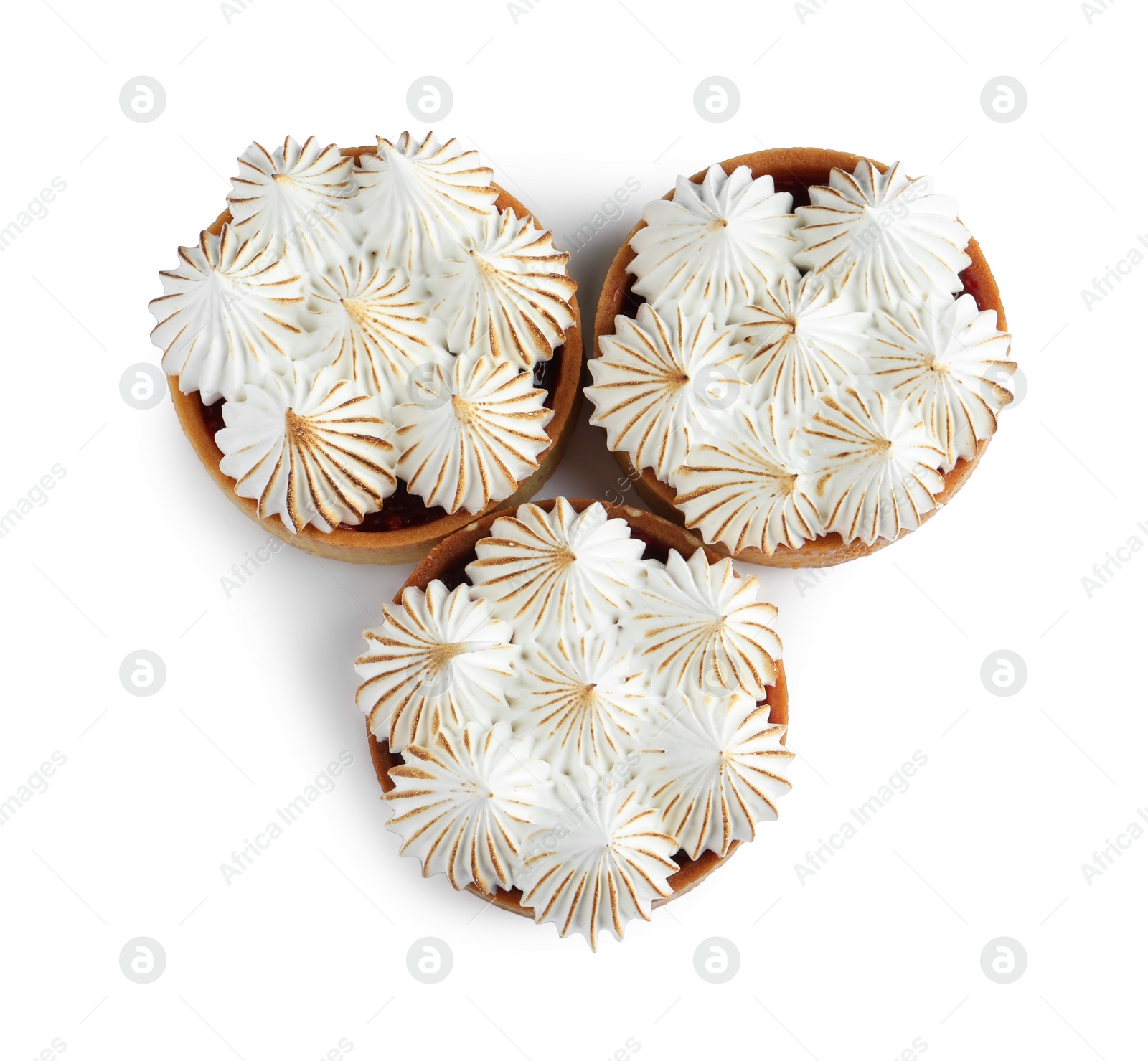 Photo of Tartlets with meringue isolated on white, top view. Tasty dessert