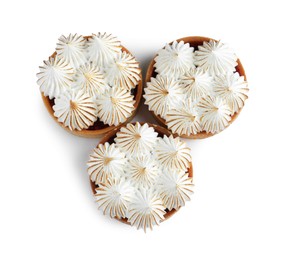 Tartlets with meringue isolated on white, top view. Tasty dessert