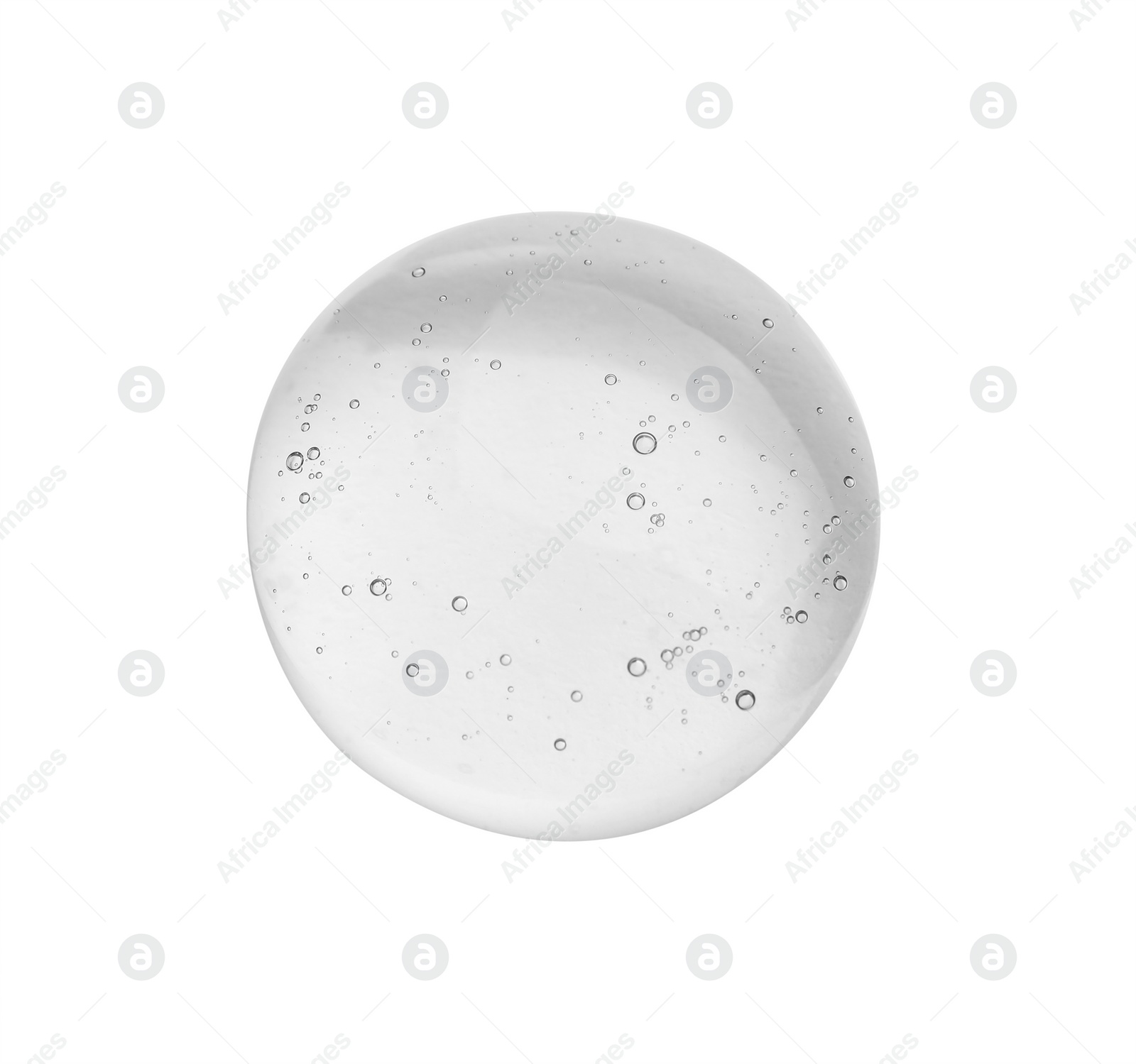 Photo of Drop of cosmetic oil on light surface, top view