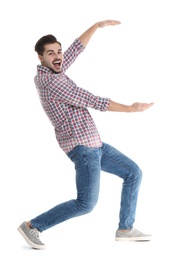 Photo of Young man with magnet attracting people on white background
