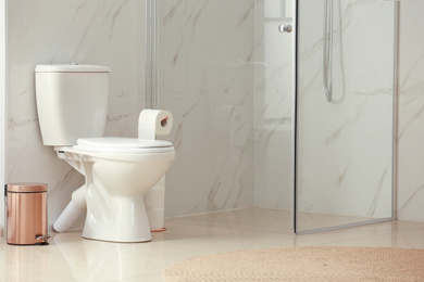 Photo of Interior of modern bathroom with toilet bowl