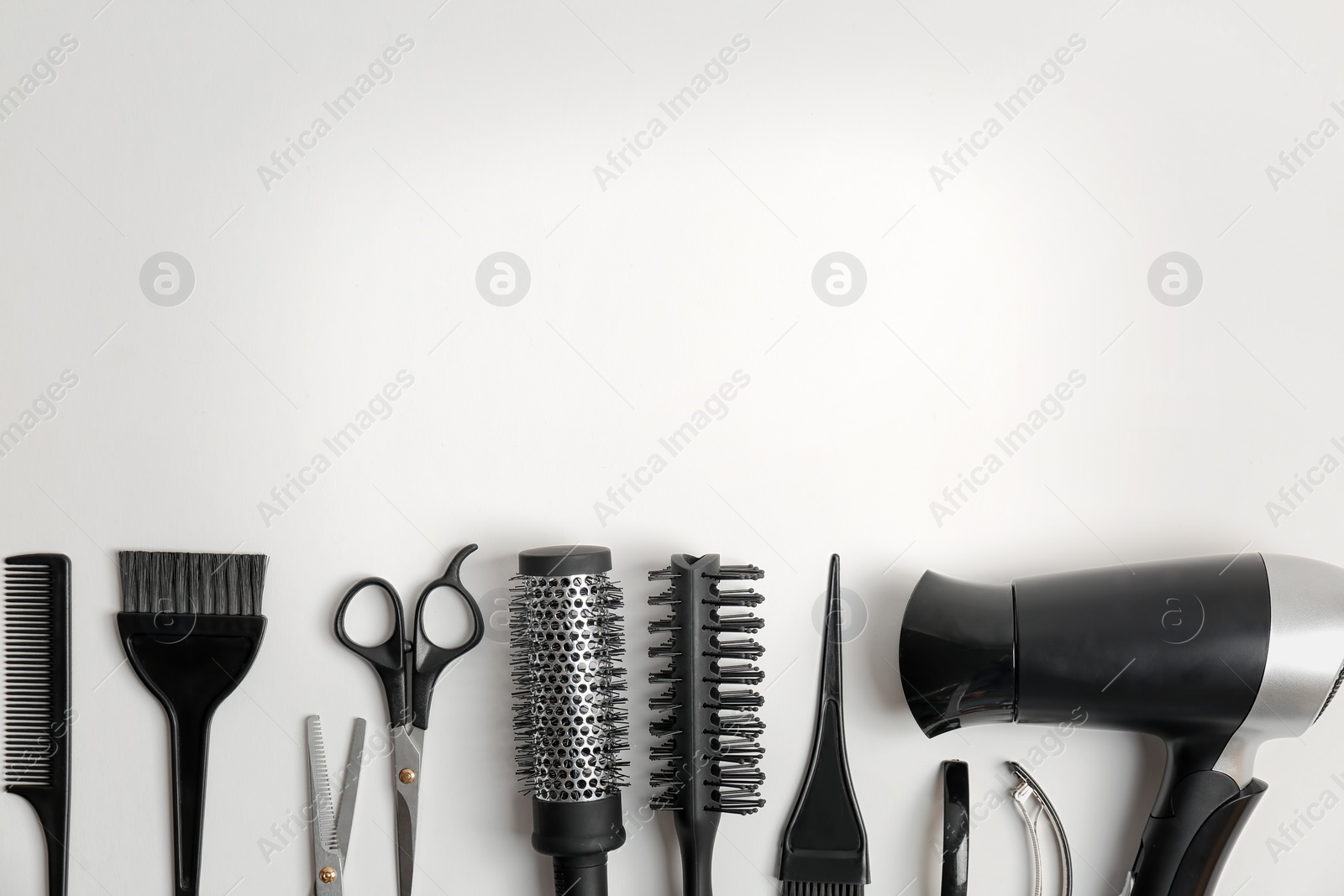 Photo of Professional hairdresser tools on white background