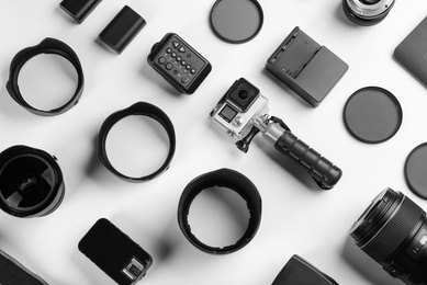 Photo of Composition with photographer's equipment and accessories on white background, top view