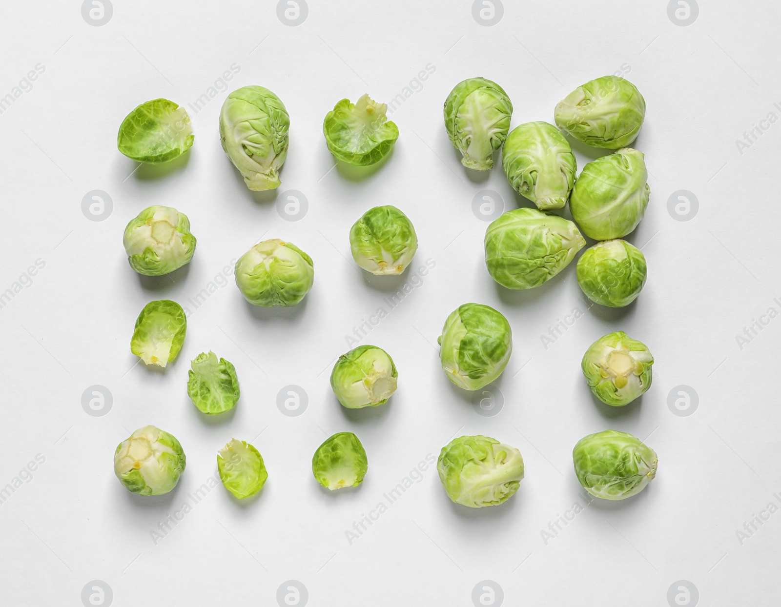 Photo of Tasty fresh Brussels sprouts on white background, top view