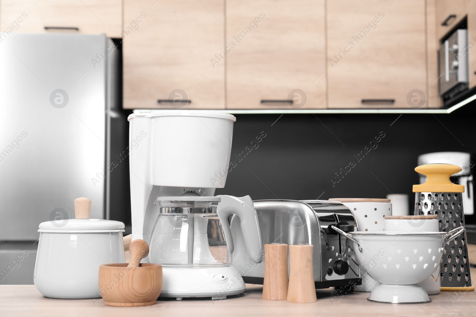 Photo of Set with modern domestic appliances in kitchen