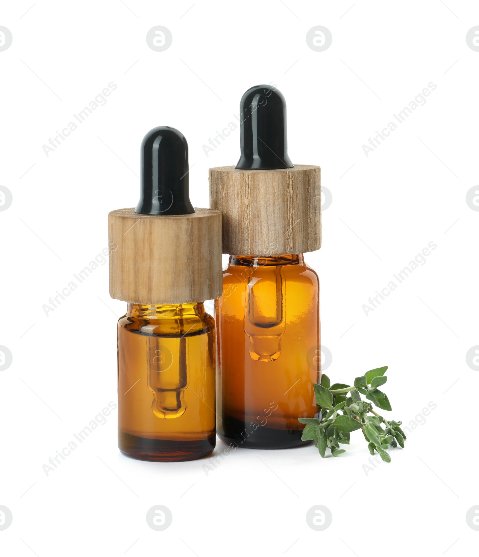 Photo of Bottles of essential oil and thyme isolated on white