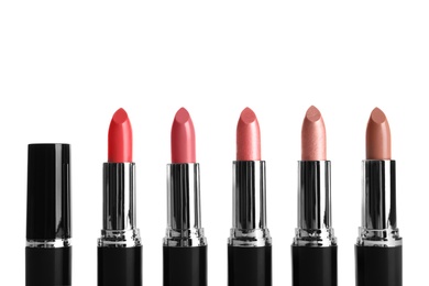 Photo of Different lipsticks on white background. Cosmetic product