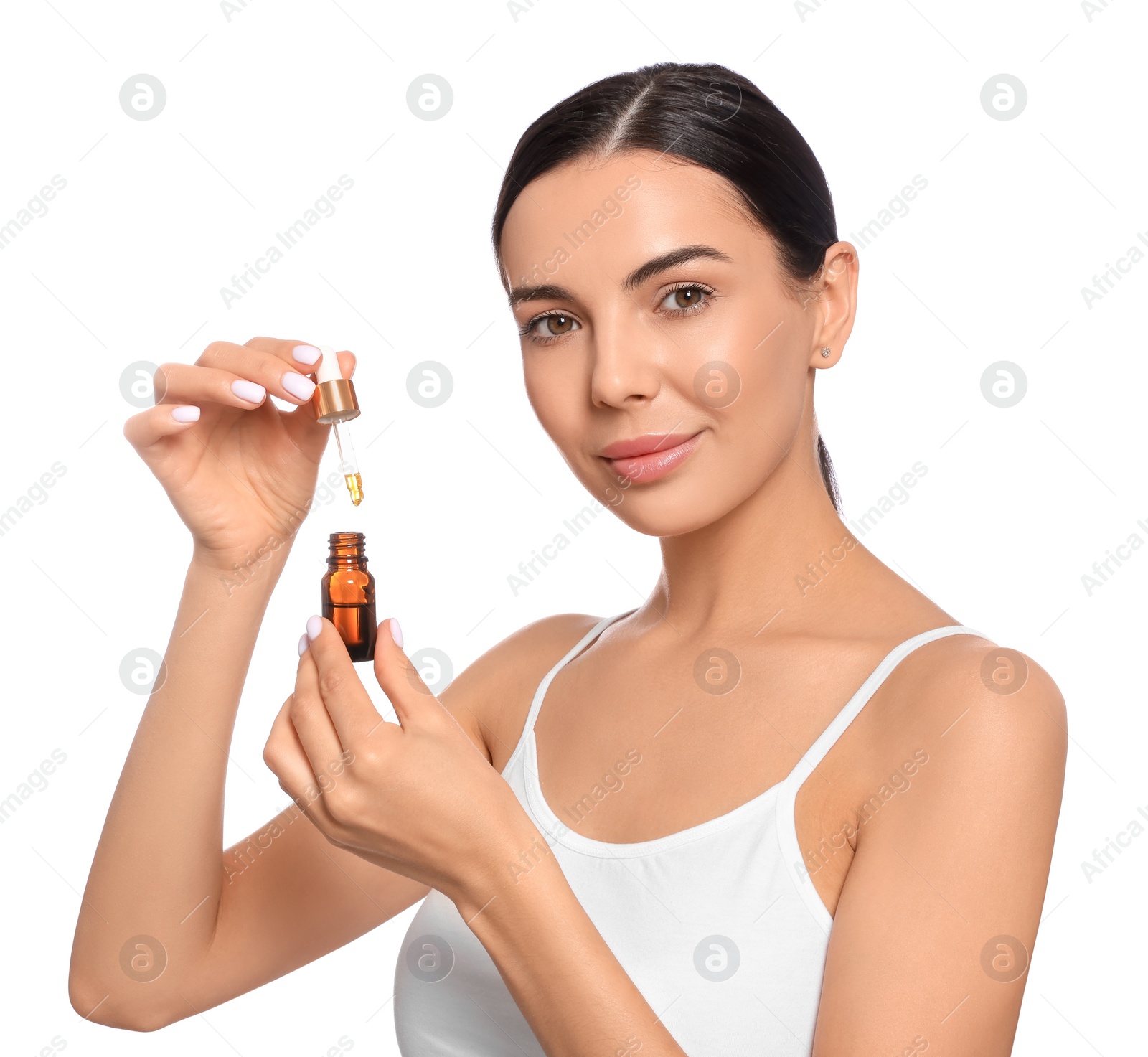 Photo of Young woman with bottle of essential oil on white background