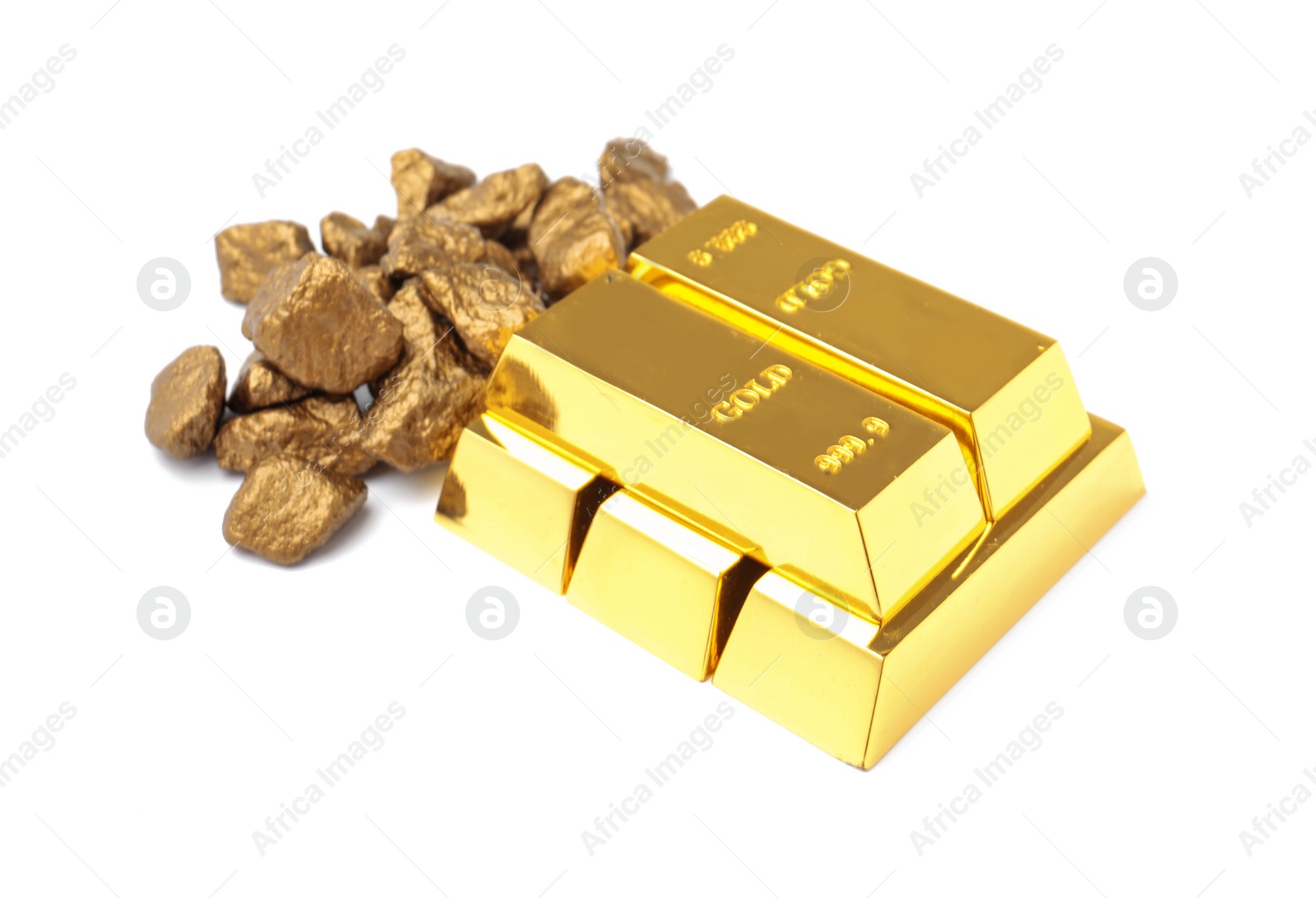 Photo of Gold nuggets and ingots on white background