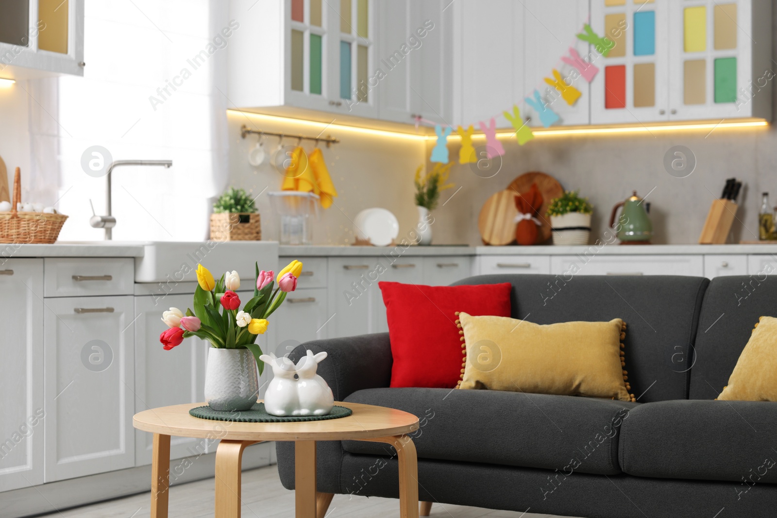 Photo of Beautiful room with Easter decor and comfortable furniture