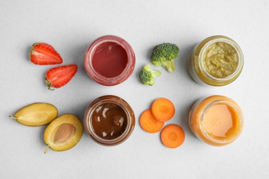 Photo of Flat lay composition with healthy baby food and ingredients on grey background