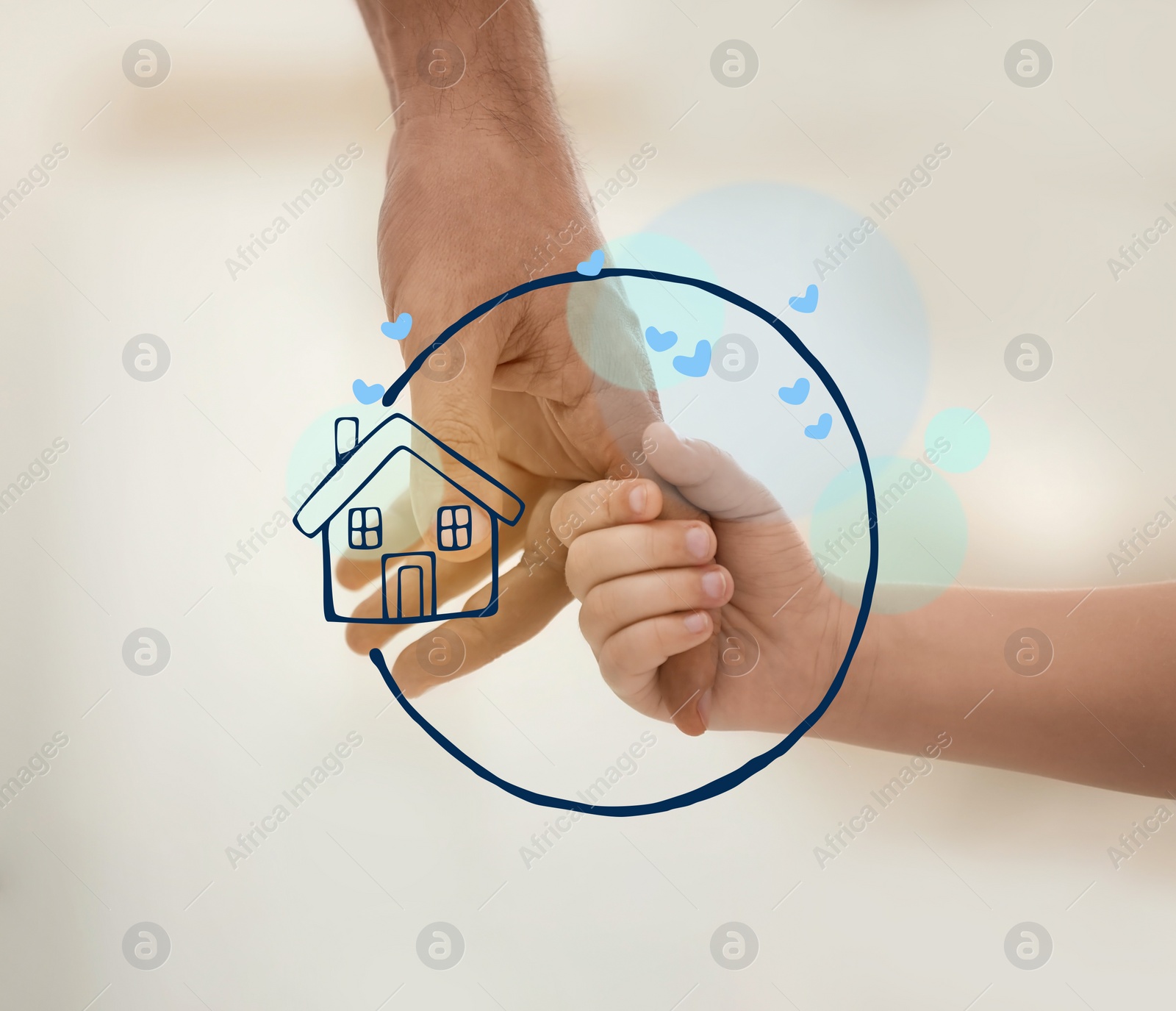 Image of Father holding hands with child and illustration of house indoors, closeup. Adoption concept