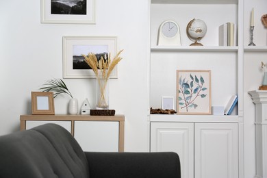 Living room interior with shelving unit, sofa and different decor