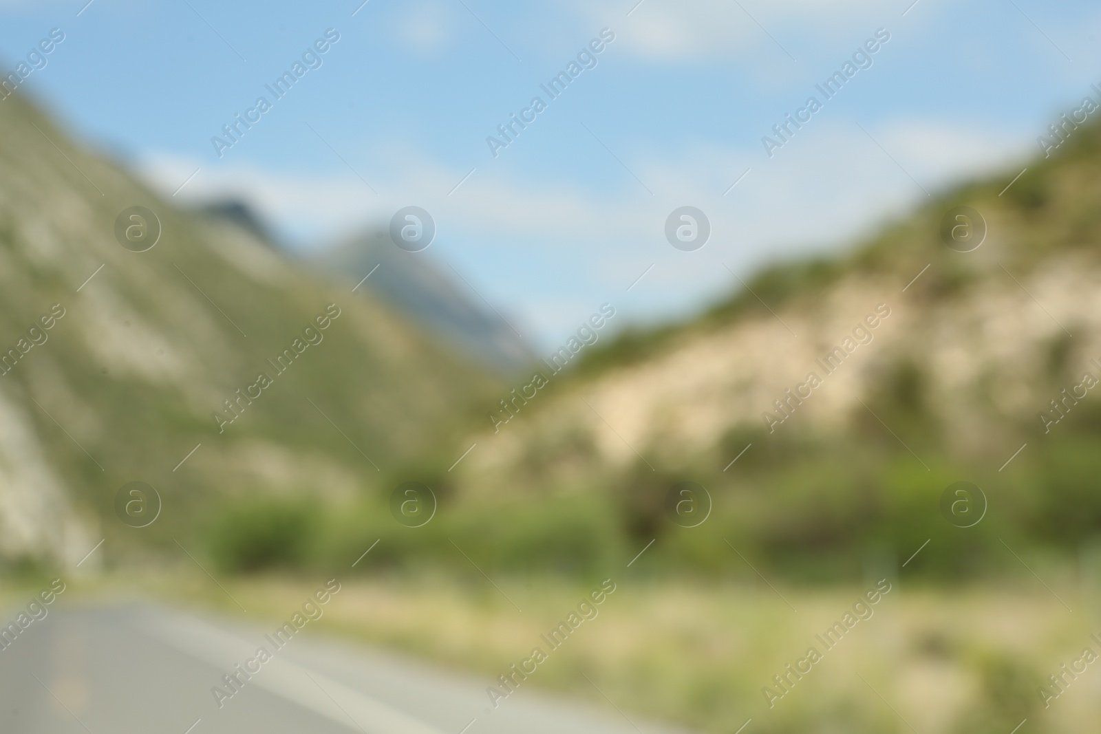 Photo of Blurred view of high mountains under sky outdoors