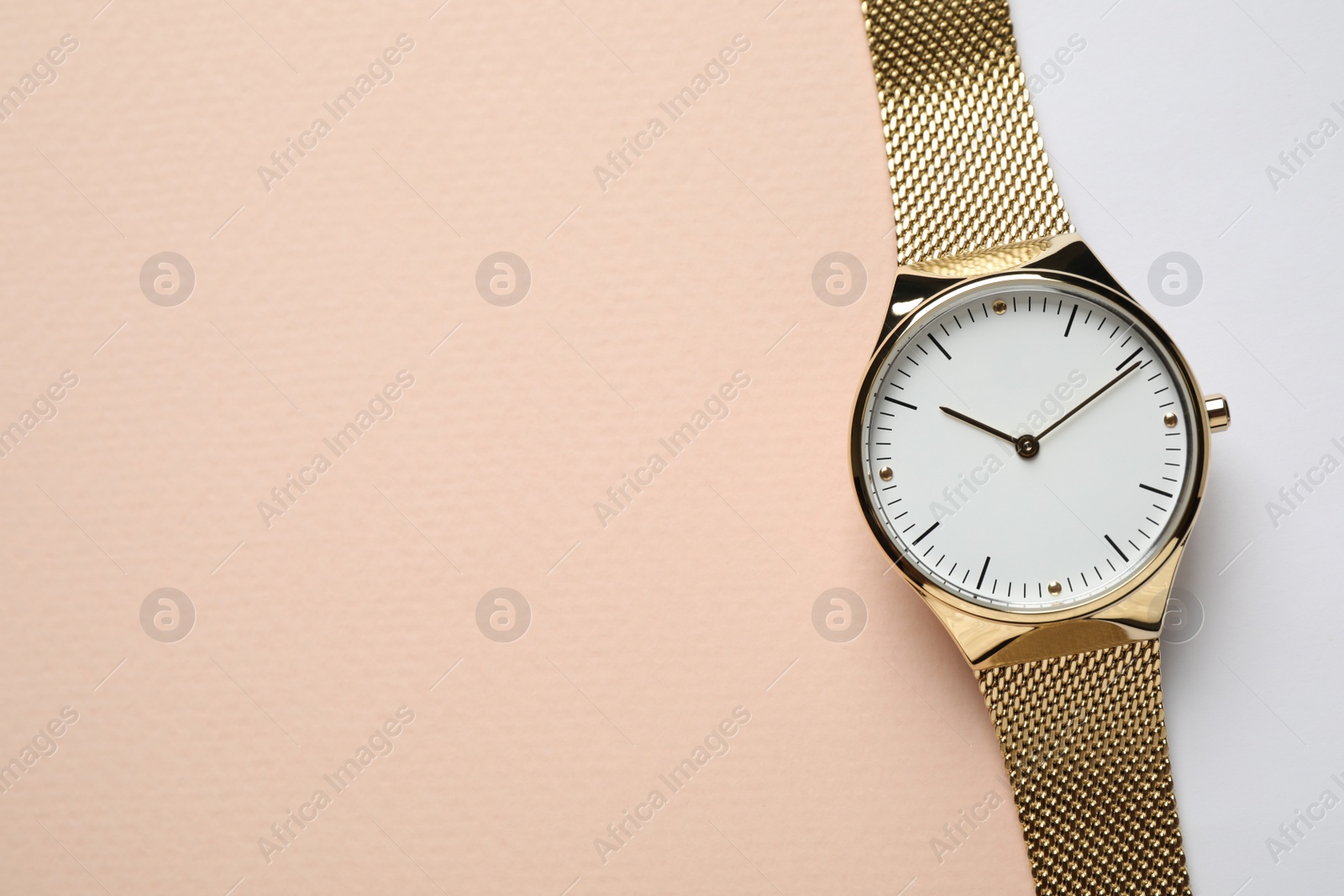 Photo of Luxury wrist watch on color background, top view. Space for text