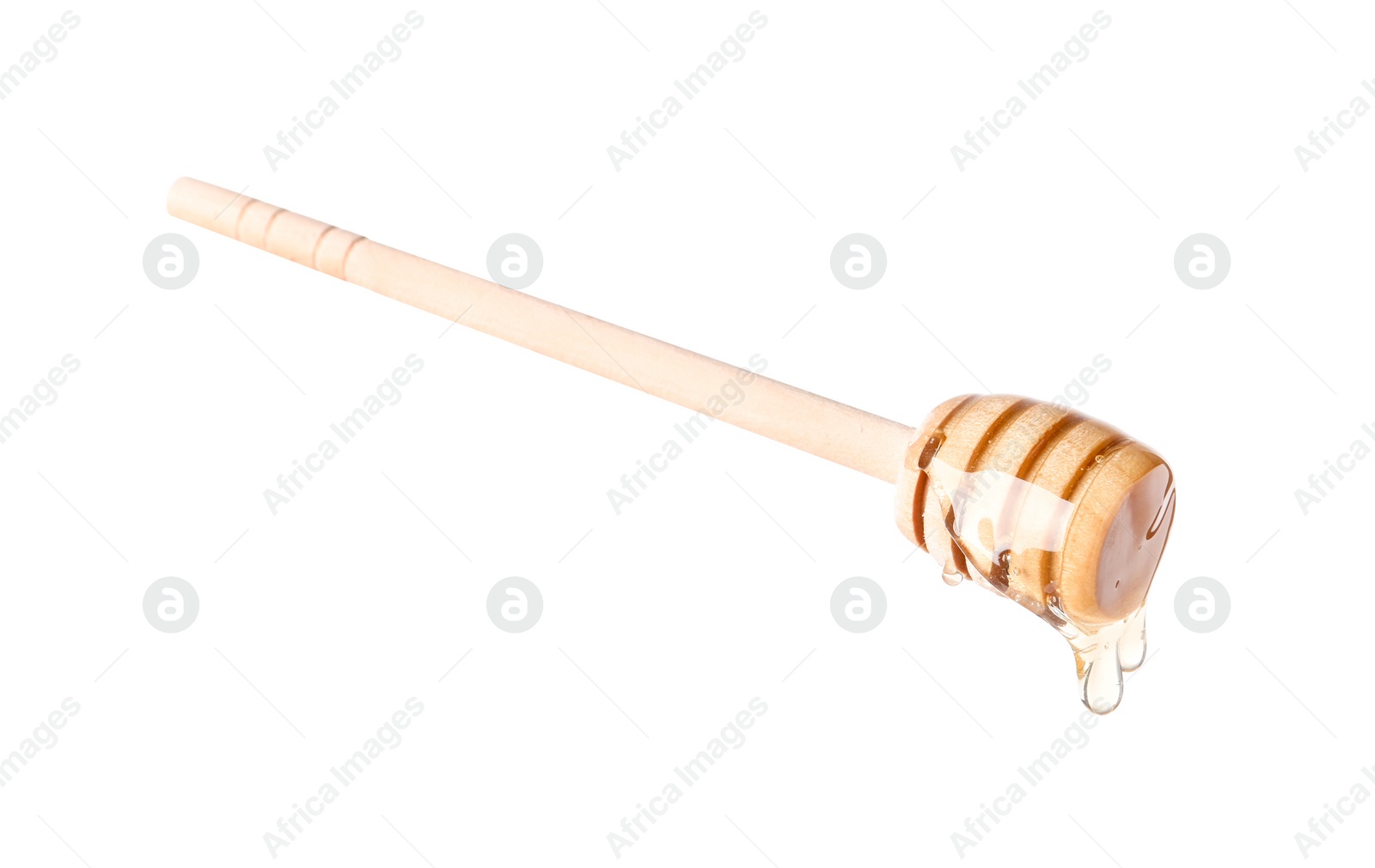 Photo of Natural honey dripping from dipper on white background