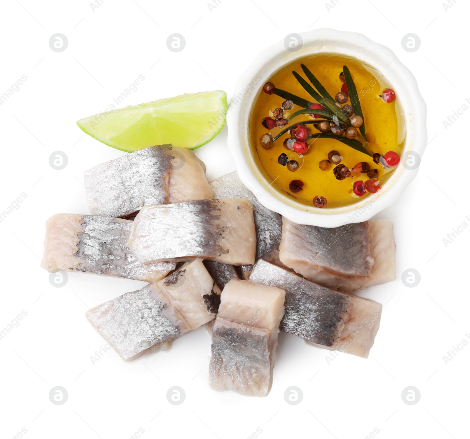 Photo of Pieces of tasty fish, lime and marinade isolated on white, top view