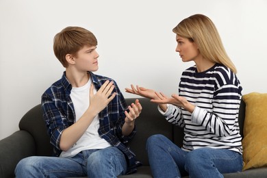 Mother and her teenage son having argument at home