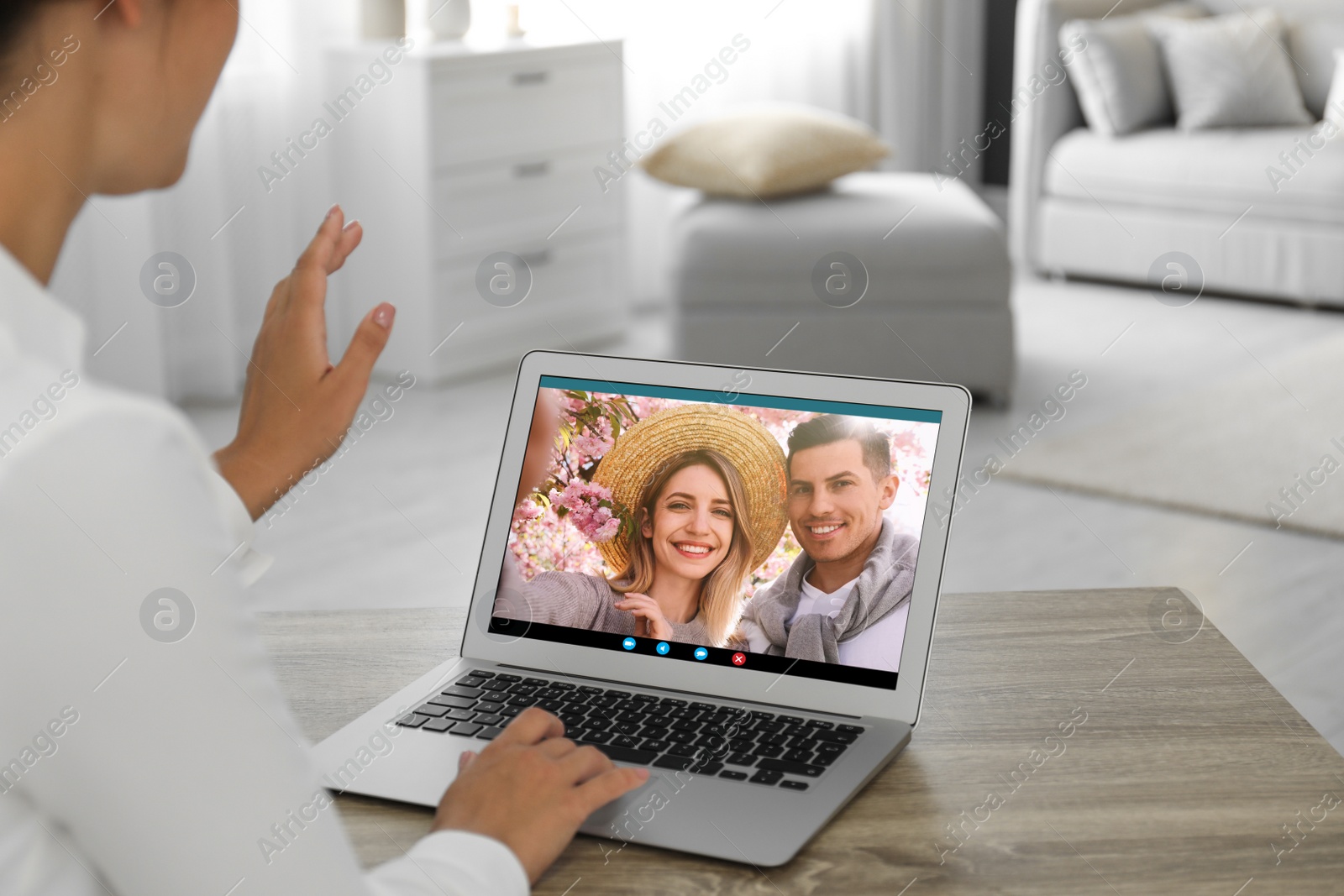 Image of Woman having online meeting with family members via videocall application at home, closeup