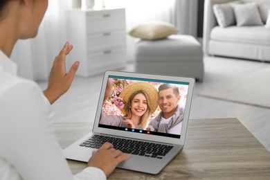 Image of Woman having online meeting with family members via videocall application at home, closeup