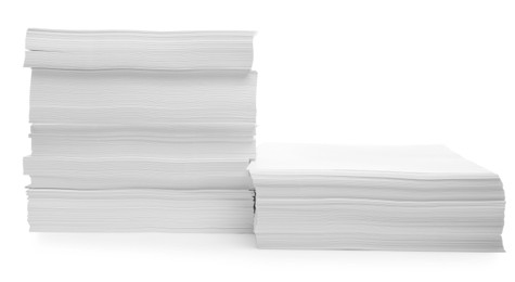 Photo of Stacks of paper sheets on white background