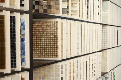 Many different samples of tiles on display in store