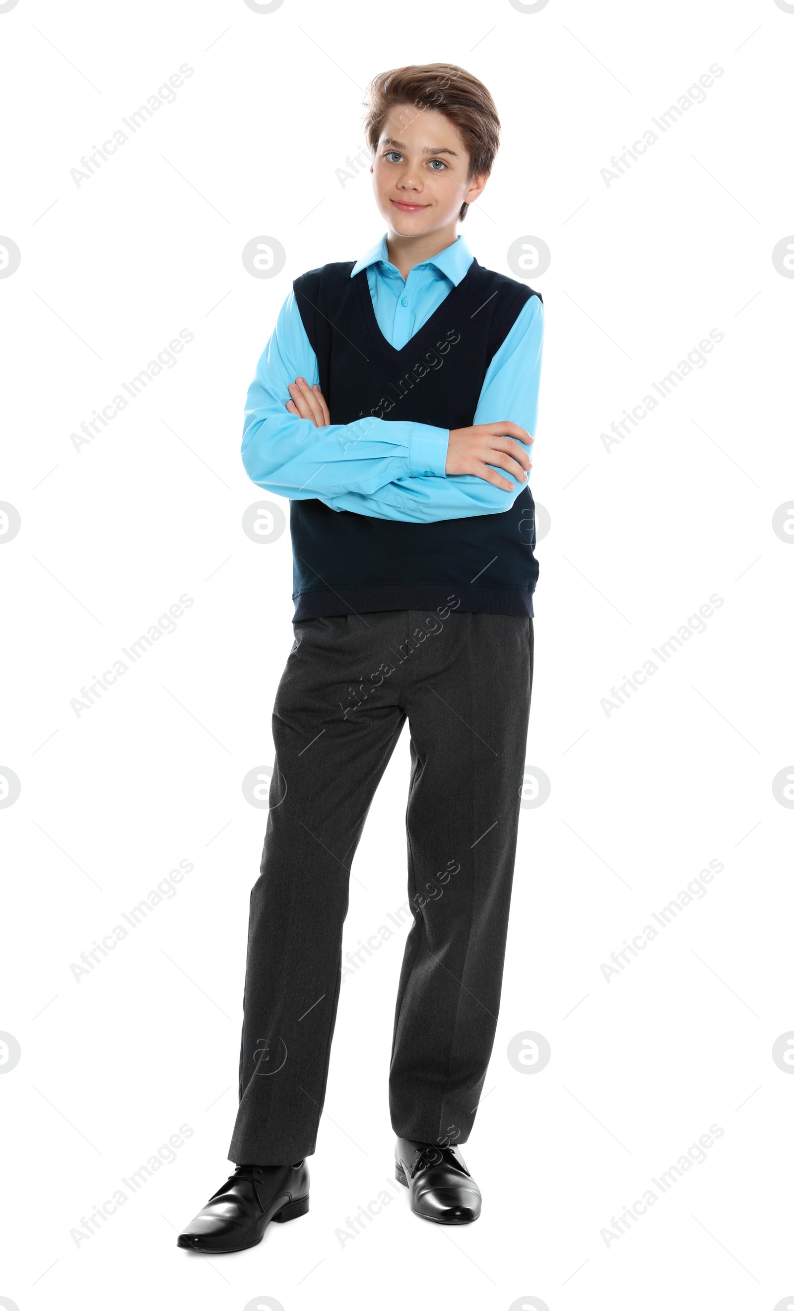 Photo of Happy boy in school uniform on white background