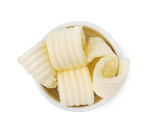 Photo of Tasty butter curls in bowl isolated on white, top view