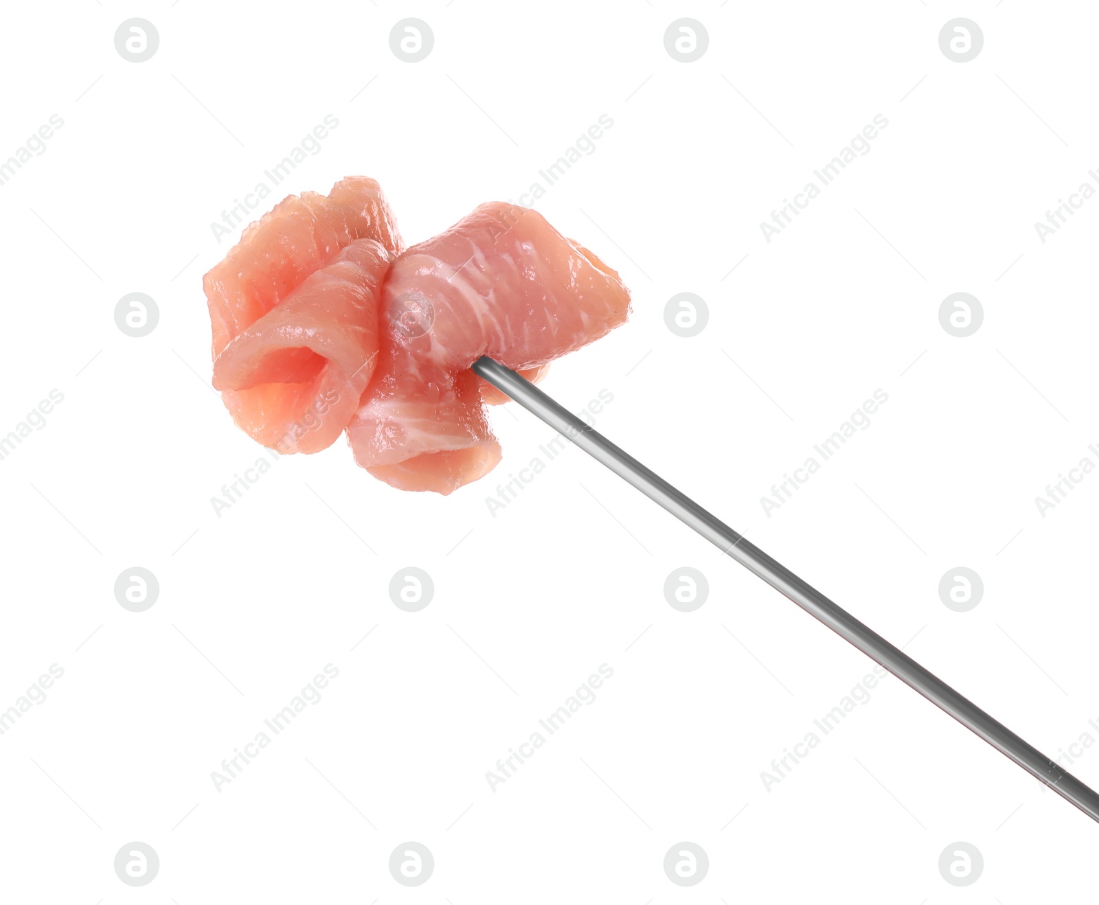 Photo of Fondue fork with pieces of raw meat isolated on white